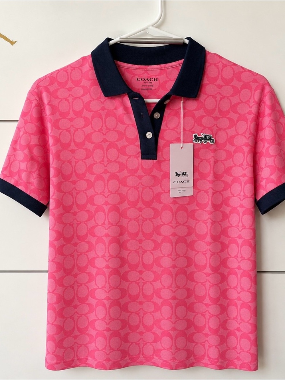 Coach women Pink Polo with Navy Trim and Signature Print